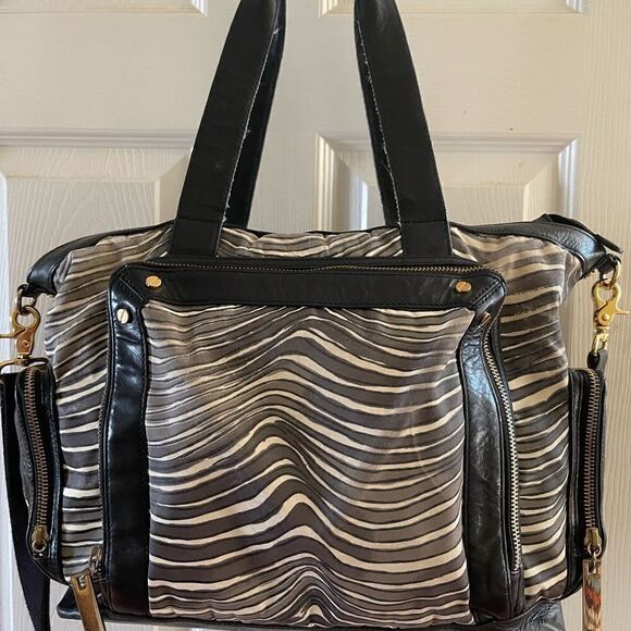 - Tory Burch Nylon Zebra prints & black leather Weekender bag with shoul… - Picture 11 of 15